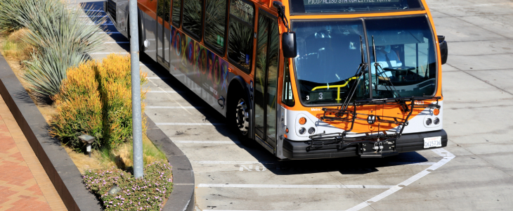 bus driving down the street