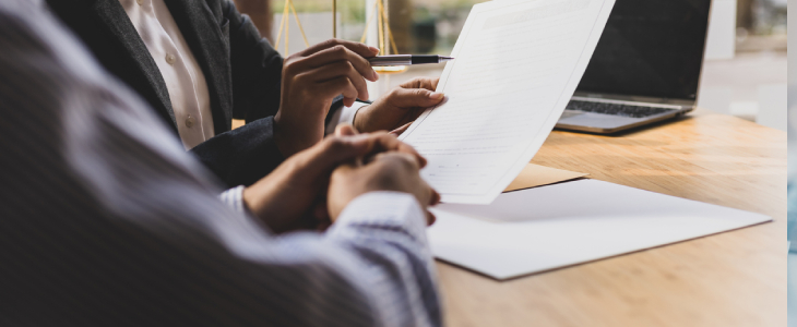 two people looking over documents