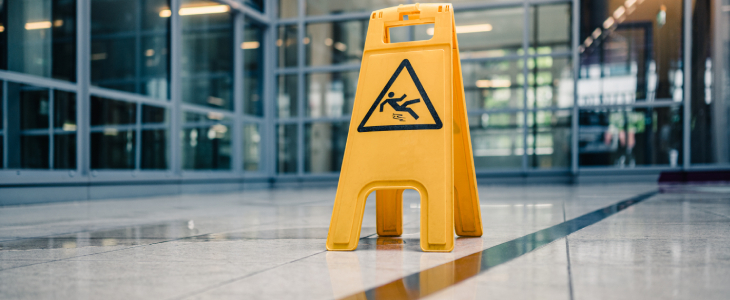 a slippery when wet sign on the floor