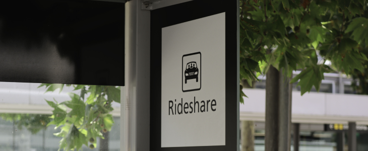 A sign reading "Rideshare" for customers that need to be picked up by Uber or Lyft.