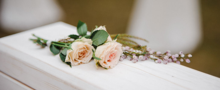 Roses on a casket to represent wrongful death of a loved one