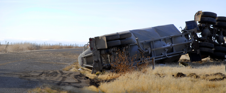 Rollover truck accident in a field