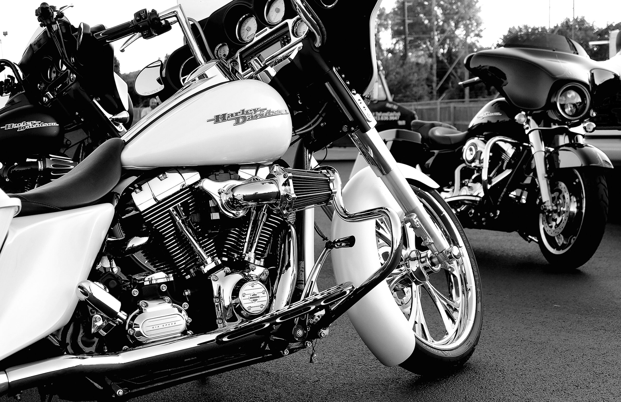 Kansas City, United States – September 24, 2021: A grayscale of a rare white Harley Davidson motorcycle on the road